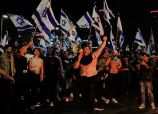 Israel Erupts in Fiery Protests: Defense Chief Dismissal Triggers Outrage Amid Judicial Overhaul Crisis